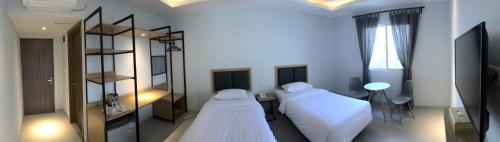 Cama o camas de una habitación en Hotel Arisu