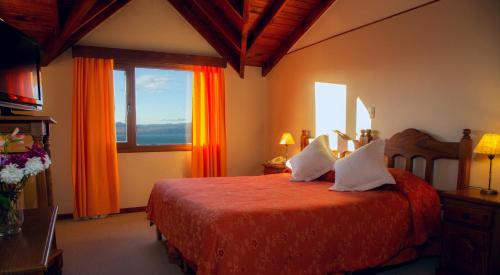 Giường trong phòng chung tại Terraza Coirones Hotel