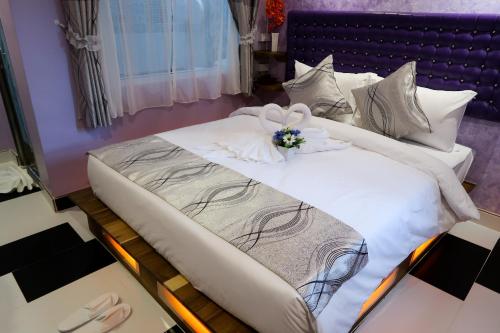 Lova arba lovos apgyvendinimo įstaigoje Nang-an Inn Resort