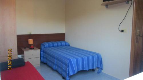 Posteľ alebo postele v izbe v ubytovaní Tranquilidad con vistas al mar
