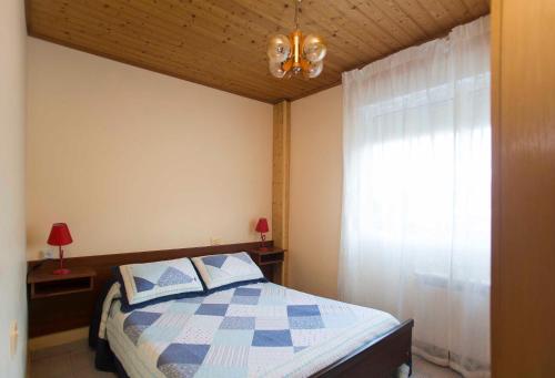Posteľ alebo postele v izbe v ubytovaní Tranquilidad con vistas al mar