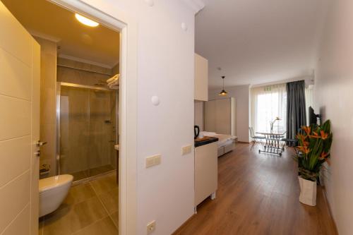 a bathroom with a sink and a toilet in a room at Joy Suites in Istanbul