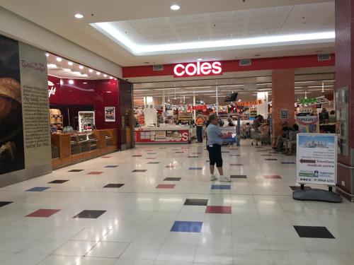 a person standing in the middle of a shopping mall at Darwin City Harbour views-Situated above the OAK Restaurant in Darwin