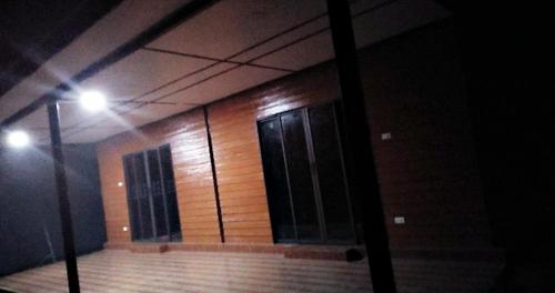 a building with two doors on the side of it at เฟรนด์แคมป์ in Khao Kho