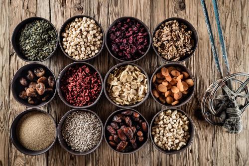 a group of bowls filled with different types of nuts at Boutique Hotel Nives - Luxury & Design in the Dolomites in Selva di Val Gardena