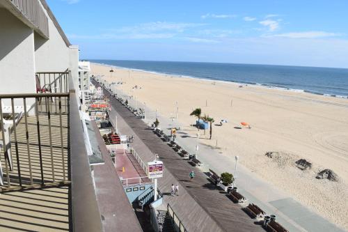 a view of a beach from a balcony of a building at Boardwalk One in Ocean City