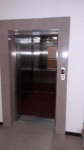 a metal elevator door in a building at Park Golden Beach Tasevski in Ohrid
