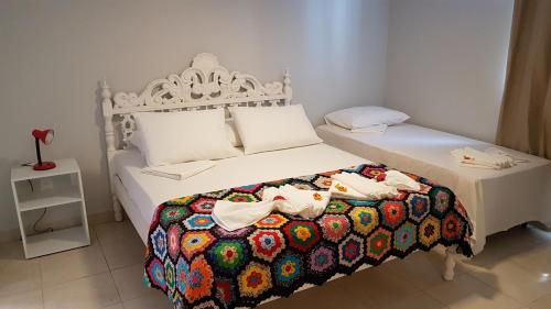 Cama o camas de una habitación en Pousada das Bromélias