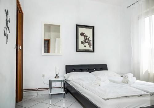 Ένα ή περισσότερα κρεβάτια σε δωμάτιο στο Apartments Tepavac