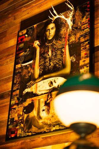 a painting of a woman on a wall at Bobby Hotel in Nashville