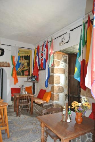 a living room with flags hanging on the wall at Casa Princess Arminda in Betancuría