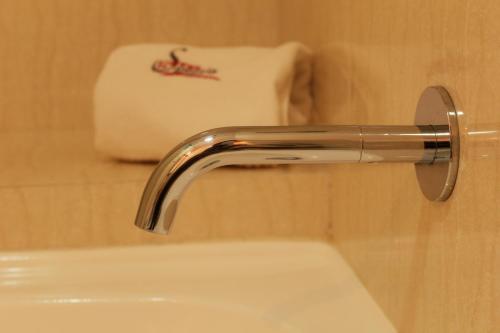 a bathroom sink with a chrome bathroom faucet at Hotel Samuria in Zamora