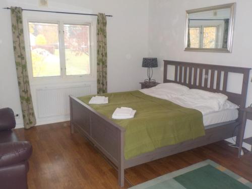 a bedroom with a bed and a window at Råda Hotel in Hagfors