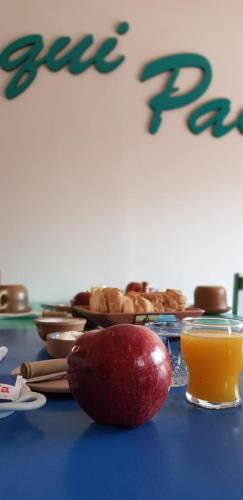 an apple sitting on top of a table with food at Hostal Asqui Pacha in Tilcara