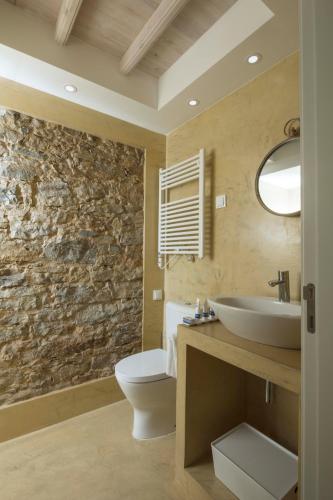 a bathroom with a white toilet and a sink at Chalet O Amorzinho Sintra Praia in Sintra