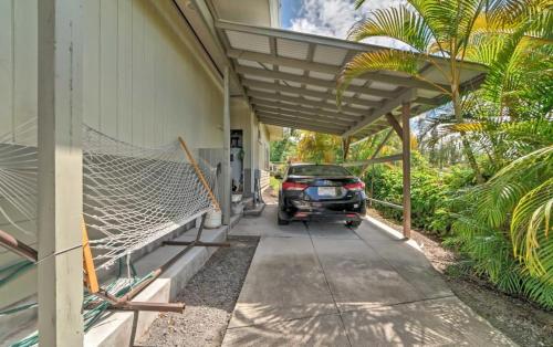 a car parked outside of a house with a net at Hale paradise in Keaau