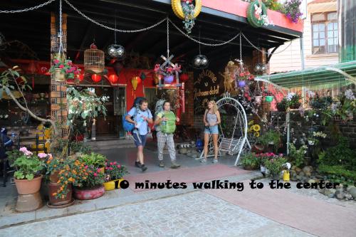 a group of people standing in front of a store at Redhouse Dalat Hotel in Da Lat