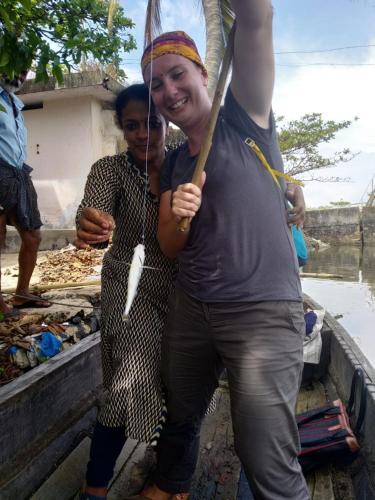 two women standing next to each other holding an umbrella at Marari Bethsaida Homestay in Shertallai