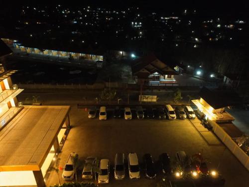 a city street filled with lots of traffic at night at Cahaya Villa Garut in Garut