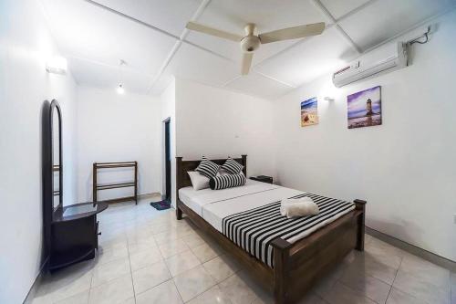 Postel nebo postele na pokoji v ubytování Cloud Inn Kandy Homestay