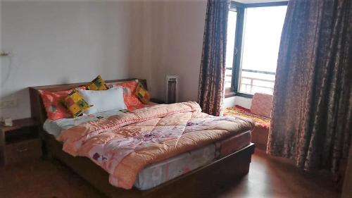 Ένα ή περισσότερα κρεβάτια σε δωμάτιο στο Viewtiful Homestay