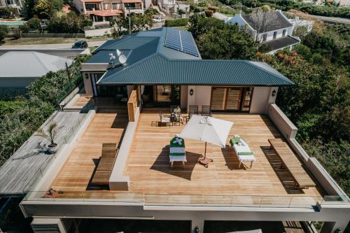 an aerial view of a house with a deck at La Vista Lodge in Plettenberg Bay