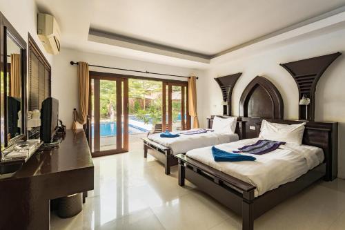 Postel nebo postele na pokoji v ubytování Koh Tao Regal Resort - SHA Plus