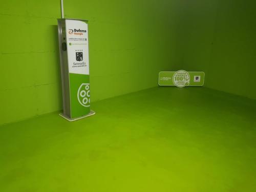 a green room with a green floor and a machine at Residence Hotel Serenella in Aprica