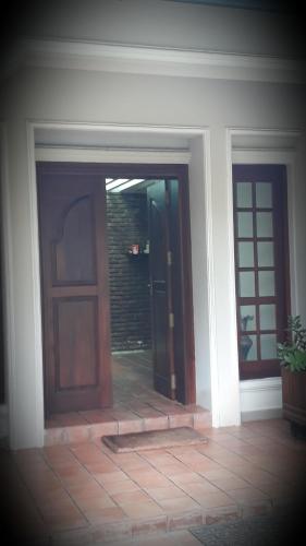 an entrance to a house with two doors at Agasthi Airport Close in Katunayake