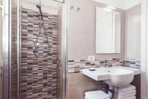 a bathroom with a sink and a shower at Luccainn in Lucca