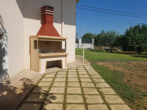 a brick oven on the side of a building at Dimitris Villa in Aígio