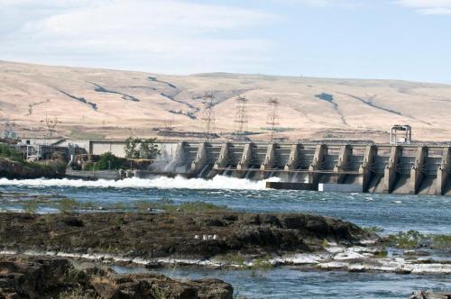 a dam on a river with water rushing through it at Celilo Inn in The Dalles