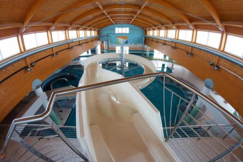 a spiral staircase on a cruise ship at Wellness & Spa Apartments Lipno - Frymburk in Frymburk