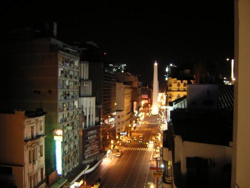 a view of a city street at night at Corrientes y Esmeralda in Buenos Aires