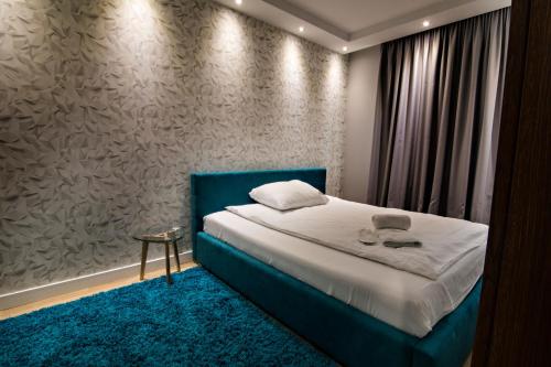 Säng eller sängar i ett rum på JAB Apartments Panoramika Business & Family