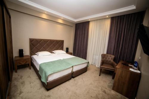 Postel nebo postele na pokoji v ubytování Boutique Hotel Mimino