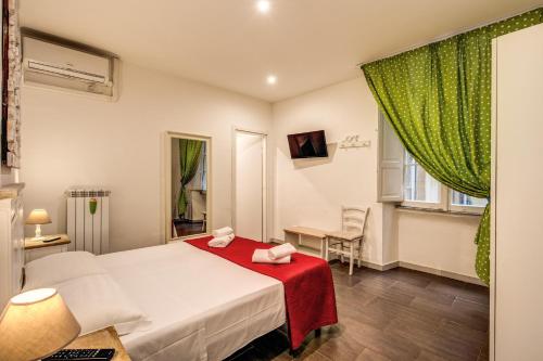 Postel nebo postele na pokoji v ubytování Guest House o Affittacamere La Civetta di Trastevere B