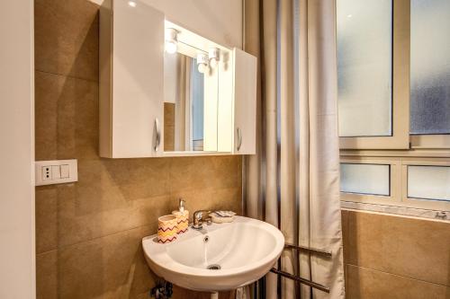 a bathroom with a sink and a mirror at Magenta Collection Del Grande 51 in Rome