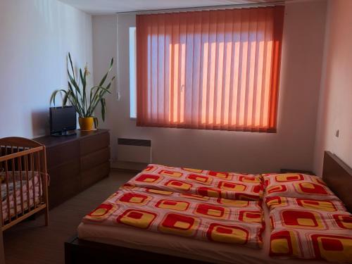 A bed or beds in a room at Ubytování Liptov