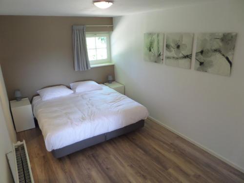 Ένα ή περισσότερα κρεβάτια σε δωμάτιο στο B&B Het Rijkzicht