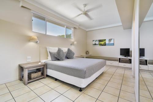 מיטה או מיטות בחדר ב-Beachfront Hamilton Island