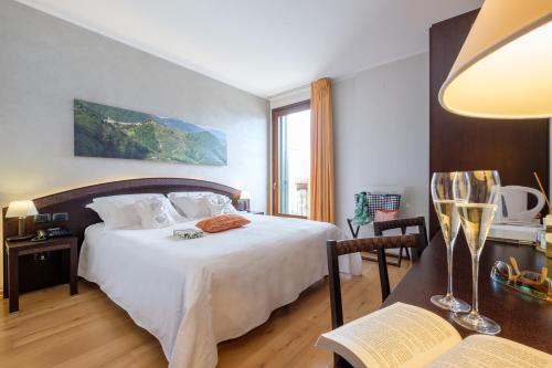 Postel nebo postele na pokoji v ubytování Wine Hotel San Giacomo Activity & Wellness