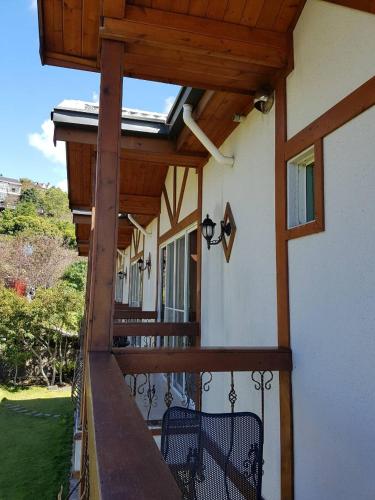 a porch with awning on a house at StarVilla in Renai