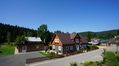a rendering of a house in a village at Chalet Schäfer s vyhřívaným bazénem se slanou vodou in Harrachov