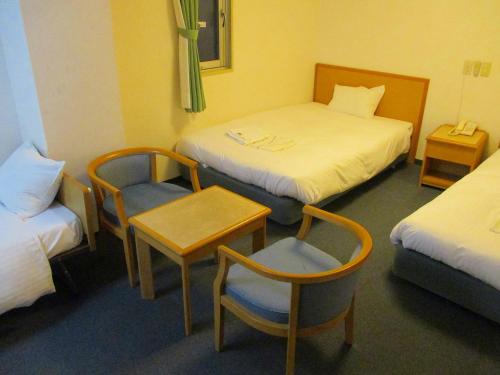 Katil atau katil-katil dalam bilik di Hotel Green Well
