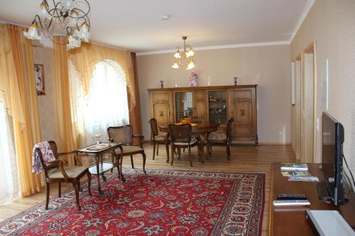 a dining room with a table and chairs and a dining room at Posthotel in Bad Bertrich