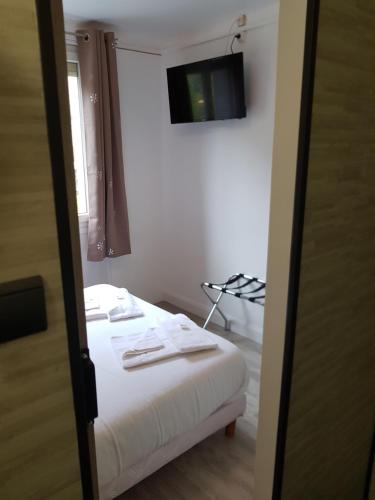 Postel nebo postele na pokoji v ubytování hotel de la gare