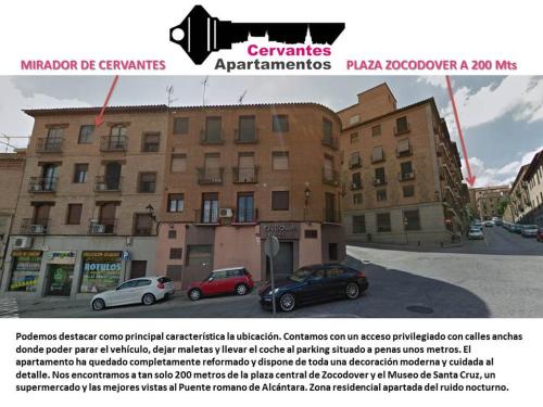 a picture of a building with cars parked in a parking lot at Mirador de Cervantes in Toledo