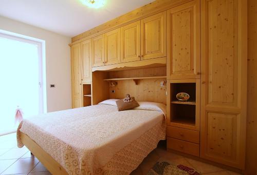 Postel nebo postele na pokoji v ubytování Paradise Apartments Paganella