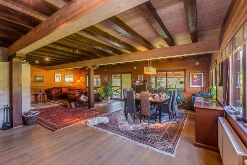 a living room with a table and a dining room at Boutique Hotel Japodi B&B in Mrkopalj